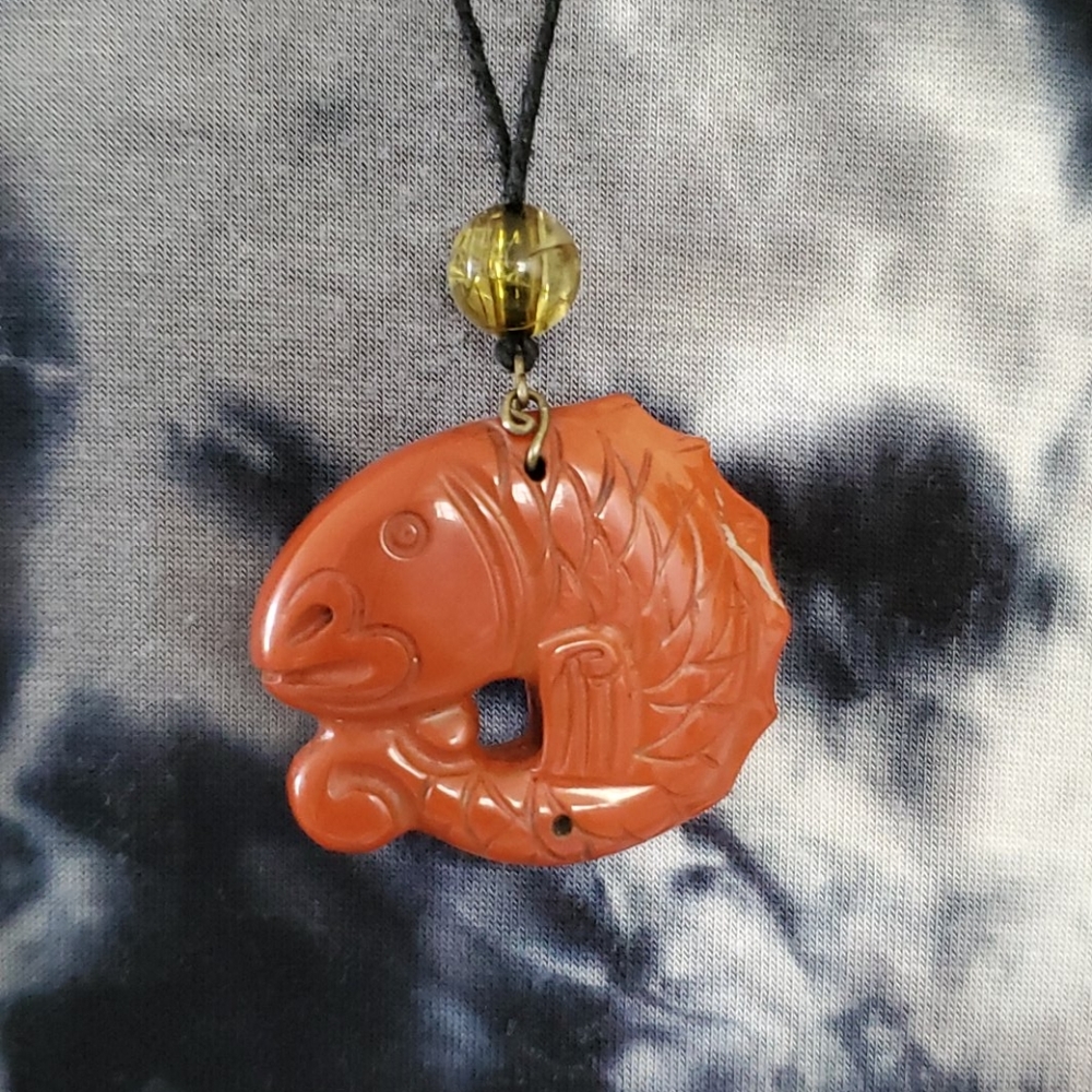 Stone carved fish pendant